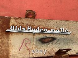Emblèmes et lettres de la Oldsmobile Hydra-Matic de 1941. Original.